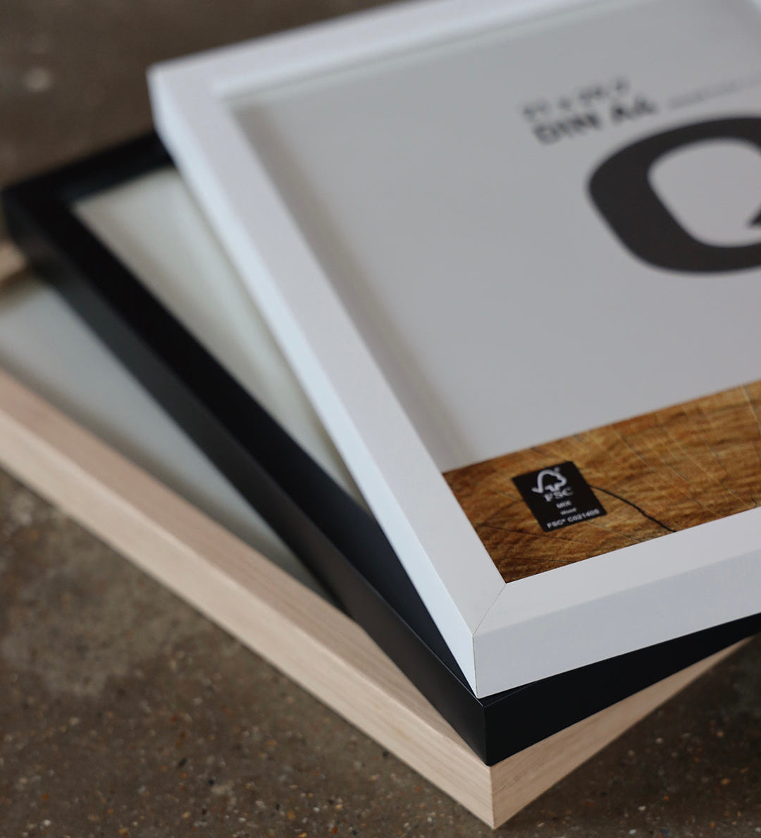 Nielsen Quadrum Frames in white, black and oak stacked